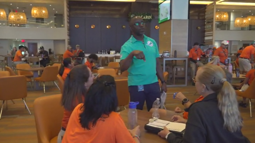 Miami Dade College professor finds his passion with side job at Hard Rock Stadium — CBS Miami, Carrollton Arts news