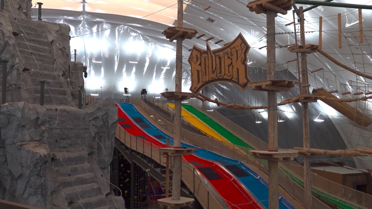 A vibrant sunset over Bolder Adventure Park in Grand Prairie, Texas.